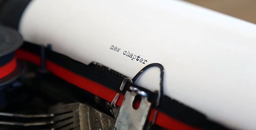 Vintage Typewriter Types 'New Chapter' on Paper