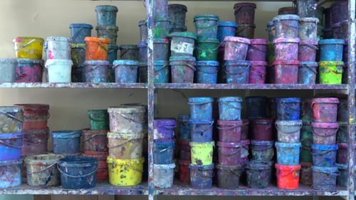 Shelves of Paint Containers in Art Studio