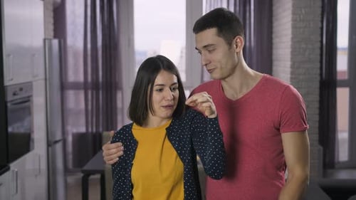Excited Couple Holds Keys in New Home