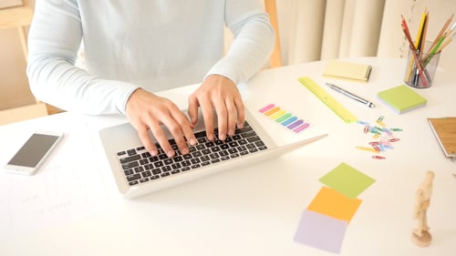Man Working And Typing On Laptop