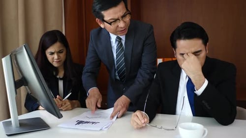 Angry boss dissatisfied with bad work result from employee in office