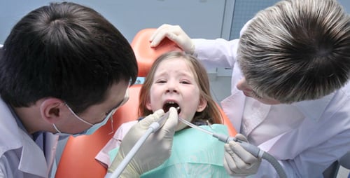 Girl Getting Dental Exam at Dentist's Office