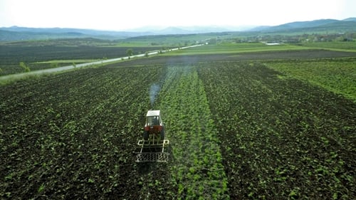 Aerial Footage of a Tractor on a Field 2
