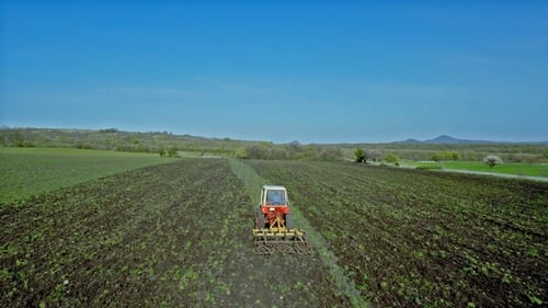 Aerial Footage of a Tractor on a Field 6