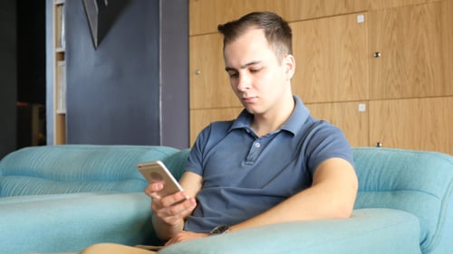 Using Phone while Sitting on Sofa