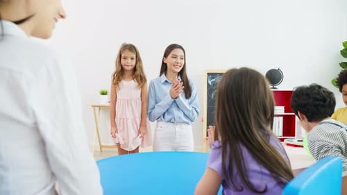Asian beautiful young woman teacher teaching a lesson to kid at school.