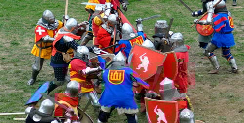 Adults Clashing in Sword Battle Historical Reenactment