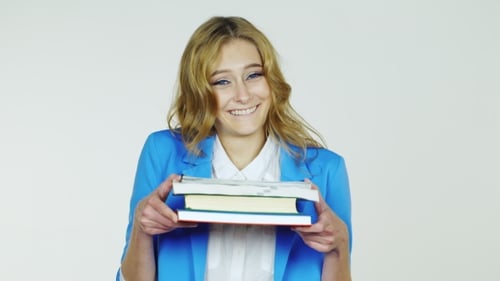 Enthusiastic Woman Holding Books and Smiling