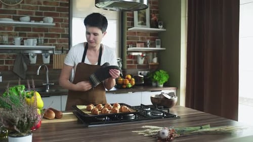 Woman Baking Croissants in Home Kitchen