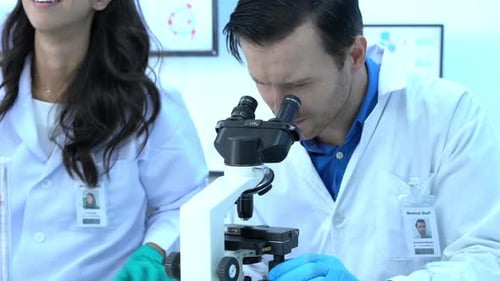 Scientist looking microscope