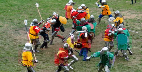 Medieval Battle Reenactment with Costumed Fighters on Field