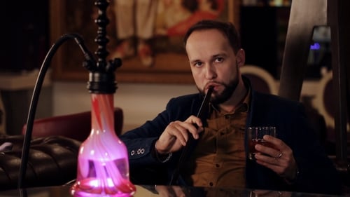 Adult Smokes Hookah and Drinks in Bar