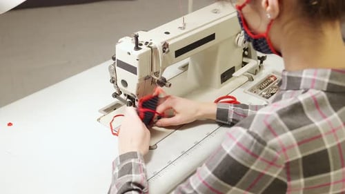 Adult Sewing a Mask Using a Sewing Machine
