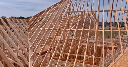 This Aerial View Shows the Construction of an Unfinished Wooden Beam House in an Unfinished State