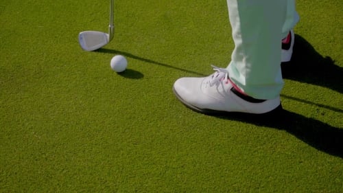 Woman Golfer Wearing Golfing Shoes