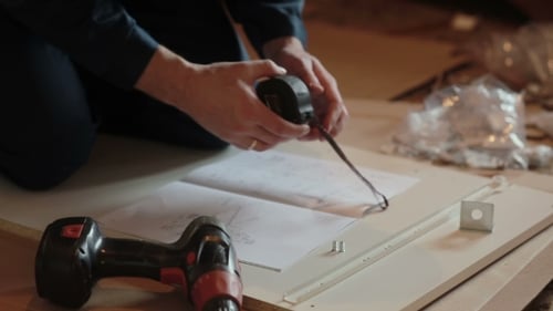 Assembling Furniture Following a Diagram at Home