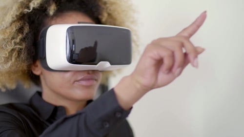 Woman Exploring Virtual Reality with VR Headset