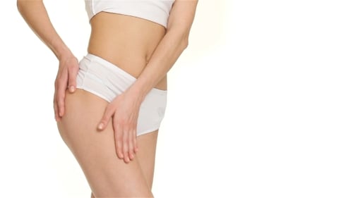 Of Woman Strokes Her Thigh