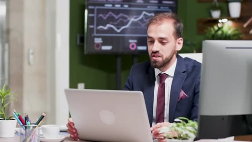 In Modern, Creative Looking Business Office Young Businessman Is Having a Video Call