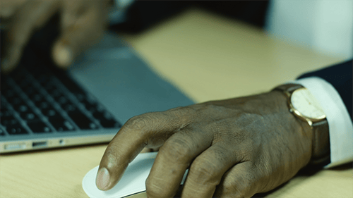 Hands Typing on Laptop Keyboard Using Mouse