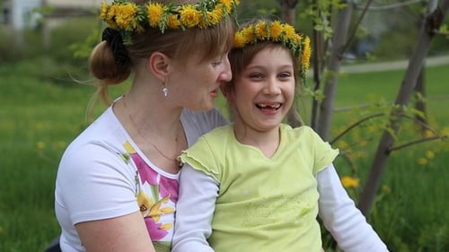 Mother and Child Wearing Matching Flower Crowns
