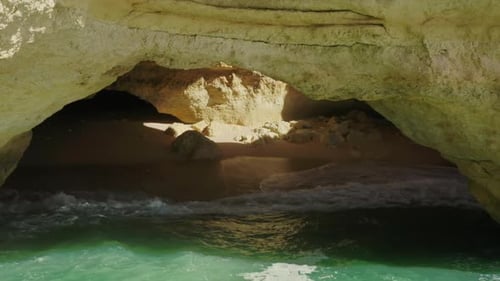 Drone Footage of Picturesque Landscape with Cave and Sea