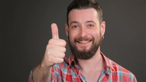 Smiling Bearded Man Gives Thumbs Up