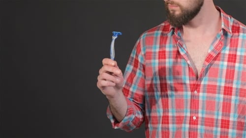 Hipster Holds Shaver