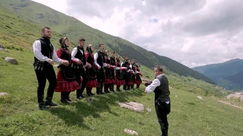 Folk Dancers Perform on Mountain Hillside