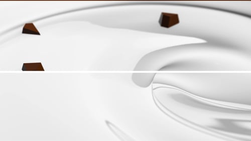 Dynamic White Liquid Flow with Floating Chocolate Chips