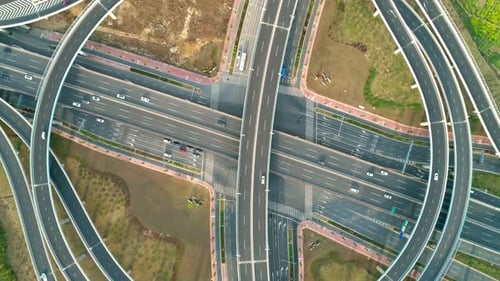 Top View to the Cars Driving on Multilevel Highway on the Sunset