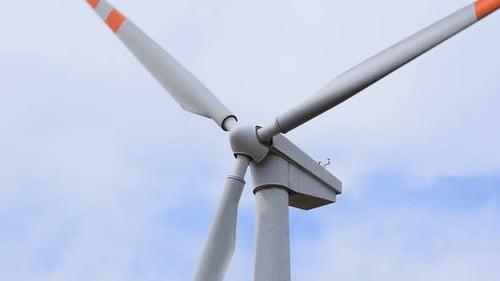 Wind Turbine Against a Partly Cloudy Sky