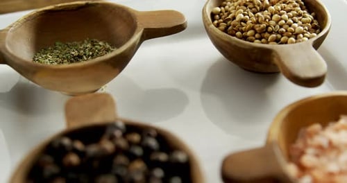 Cooking Spices Arranged in Wooden Bowls Close Up