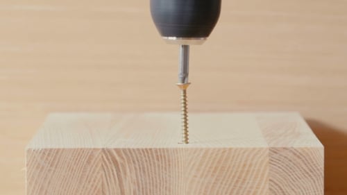Screw Being Screwed Into a Piece Of Wood