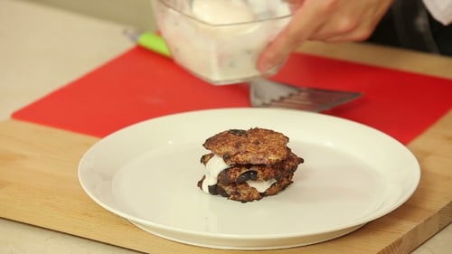 Cook Stacking Pancakes with Creamy White Sauce