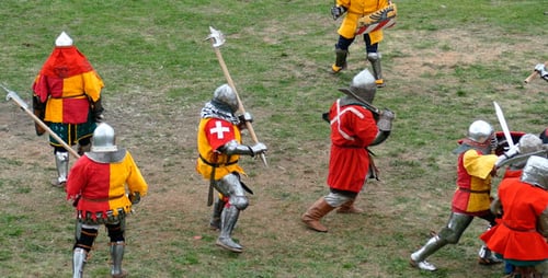 Medieval Knights Fighting in Full Armor on Grassy Field