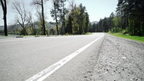 Female Runner Jogging On Mountain Road Training For Marathon.