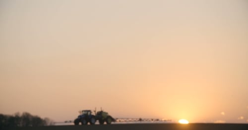 Tractor Spray Fertilize On Field With Chemicals In Agriculture Field.