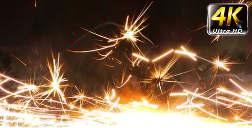 Bright Sparks of Light Against Dark Background