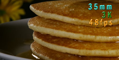 Golden Pancakes Stacked High with Sweet Syrup