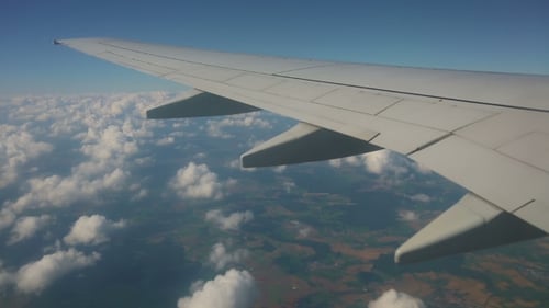 Aerial View From The Airplane On Cumulus Clouds