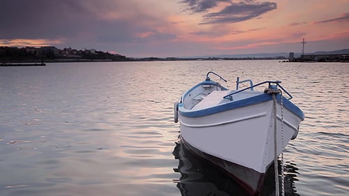 Small Boat on the Water at Sunset