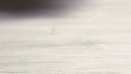 Green Salad Falling On White Table