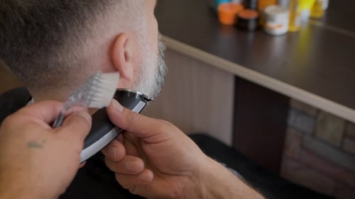 Man Getting Beard Trim at the Barber Shop