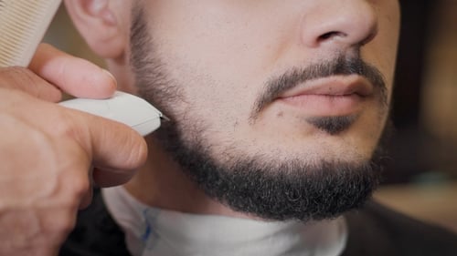 Man Getting a Beard Trim at the Barber