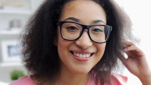 Happy Woman Smiling Wearing Glasses Indoors