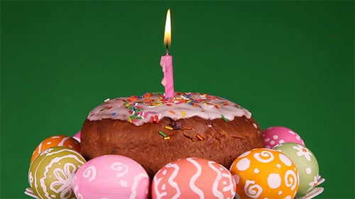 Rotating Easter Cake With Candle And Eggs