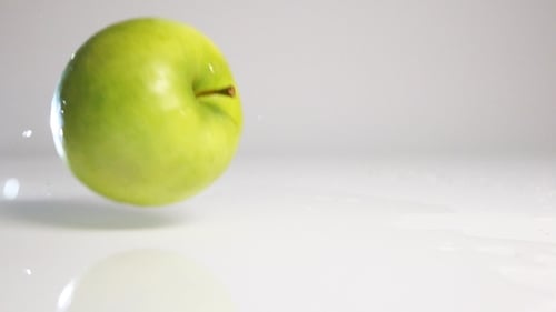 Green Apple Fall On White Surface