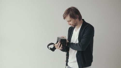 Man Wears The Virtual Reality Headset, Doing Movements And Looking Around