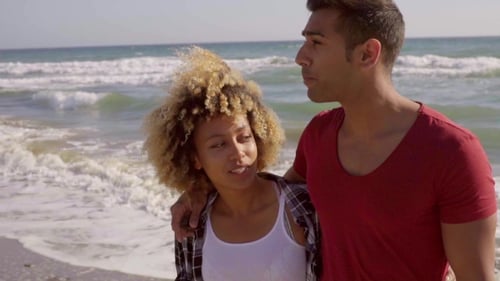 Young Mixed-Race Couple On The Beach